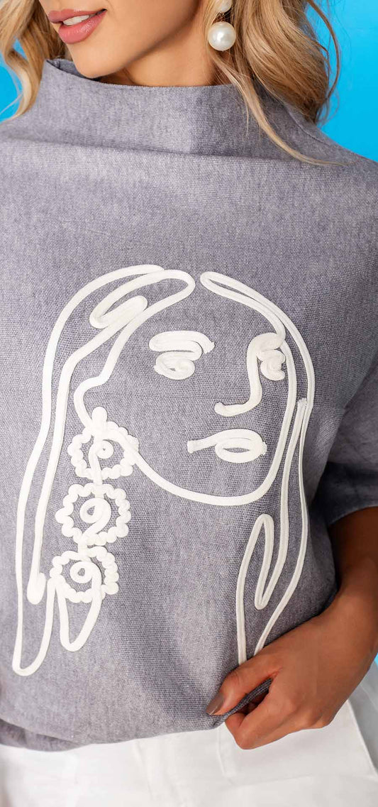 Buzo tejido, manga corta Y  silueta amplia. 